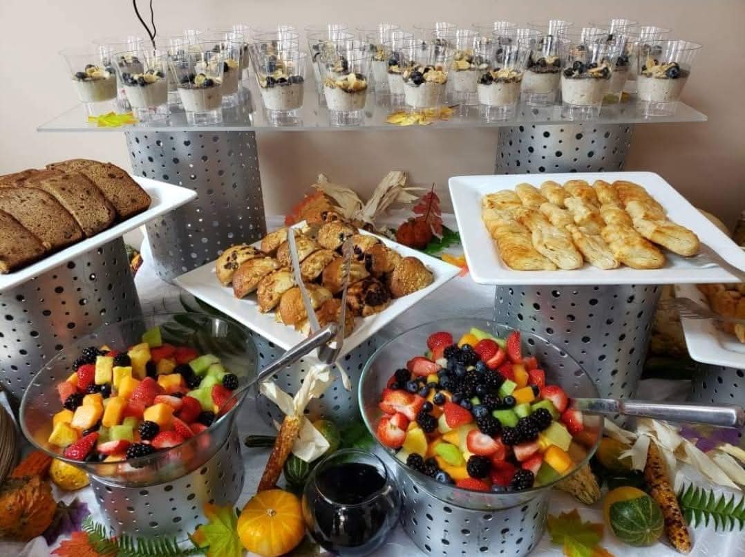 Elegant breakfast display with parfaits, pastries, and fresh fruit